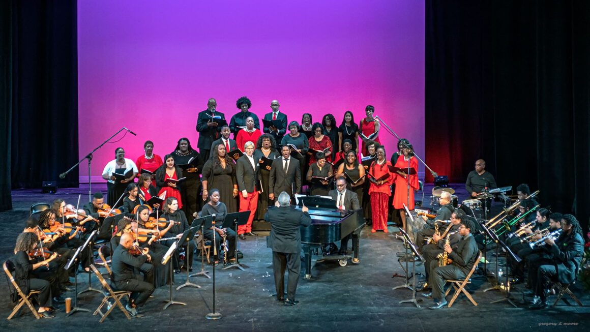 A group of people standing on top of a stage.